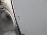 a toilet that is in the bathroom with water coming out of it