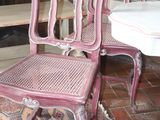two chairs sitting next to each other in a room