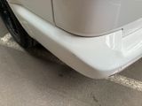 a close up of a white car with a black rim