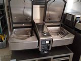 three stainless steel sinks in a commercial kitchen