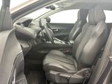 the interior of a car with two leather seats and a steering wheel