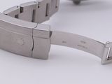 a watch that is sitting on a white surface