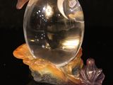 a glass ball with a fish inside of it