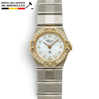 an image of a close up of a wrist watch with diamonds on it