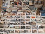 a lot of old postcards on the floor