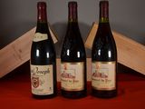 three bottles of wine sitting next to each other on a table