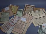 a lot of old papers on a blue table