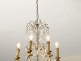 a chandelier hanging from the ceiling in a room