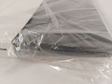 a laptop in a plastic bag sitting on a table