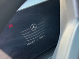 a close up of a car dashboard with a mercedes logo on it