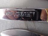 a knife that is sitting on the seat of a car