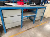 an image of a workbench with a computer on it