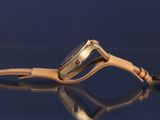 a close up of a wrist watch on a table