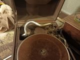 an old record player sitting in a suitcase on the floor