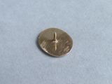 a small metal button with a star on it