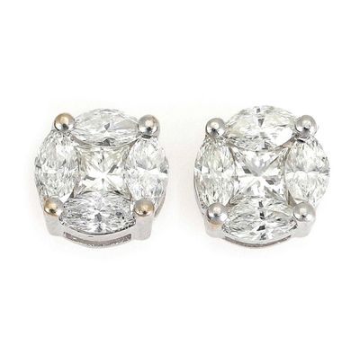 a pair of diamond earrings on a white background