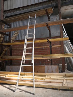 a ladder that is leaning against a wall in a building