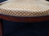 an image of a wooden chair with a patterned upholstered seat