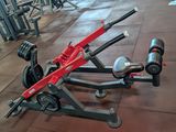 a red and black gym equipment sitting on the floor