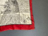 a red scarf with a map on it on a table