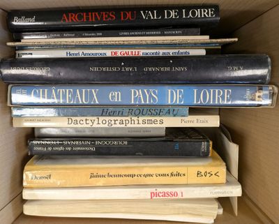 many books stacked on top of each other in a box