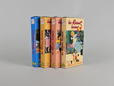 three books are stacked on top of each other on a white surface