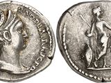 a silver coin with an image of a woman holding a bird