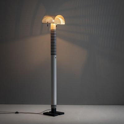 a lamp that is sitting on a table in a room