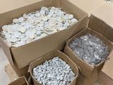 many boxes of coins sitting on the floor in a store