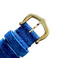 a close up of a blue strap with a gold buckle