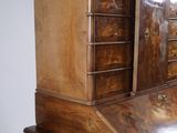 a wooden desk with a drawer on top of it
