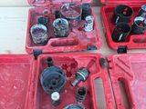 a lot of tools in a red case on a table