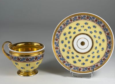an image of a cup and saucer with a saucer on the side