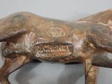 a statue of a horse that is standing on a table