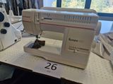 a sewing machine sitting on a table in a room