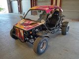 une photo d'un buggy garé dans un garage