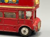 a red double decker bus that is on display