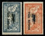 four different postages of different colors and sizes on a black background