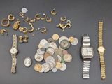 a lot of gold and silver jewelry on a table