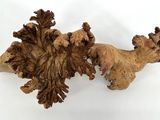 two pieces of wood on a white surface