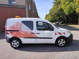 a van that is parked on the side of the road