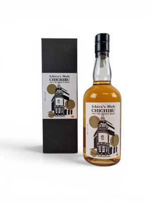 an image of a bottle of whisky next to a box