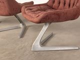 pair of mid - century modern lounge chairs in red velvet upholstered