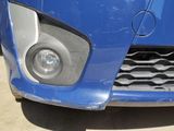 a close up of the front of a blue car