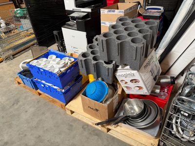 many different types of tools on a pallet in a warehouse