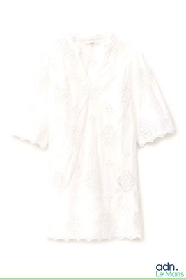 an image of a white shirt with a flower pattern on it