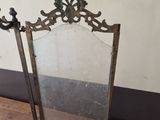 a mirror that is sitting on a wooden table