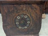 a wooden cabinet with a clock on top of it