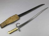 an old knife and a wooden handle on a white surface