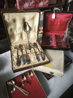 a box with spoons and spoons in it on a table